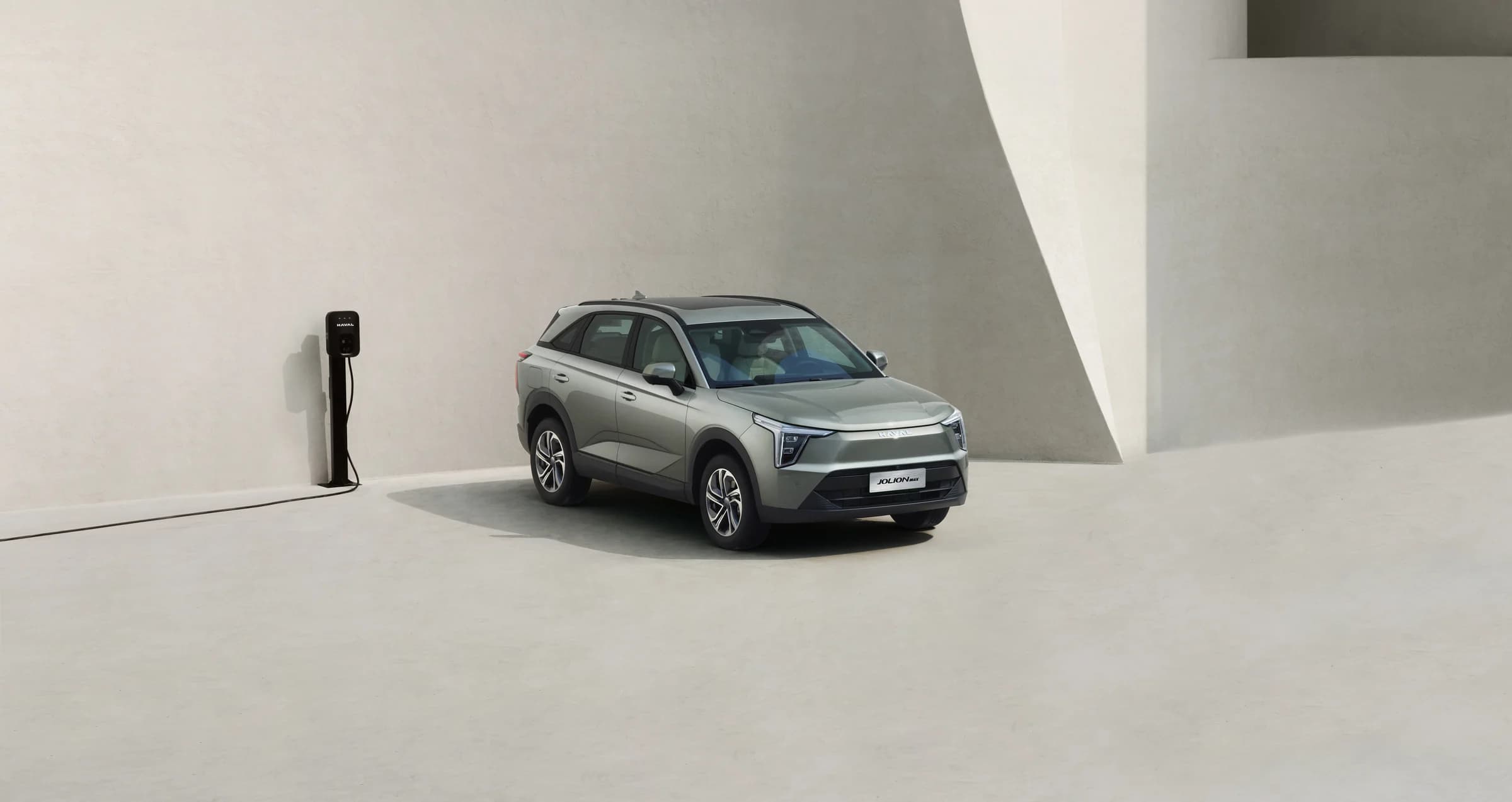HAVAL Jolion Max EV parked next to an EV charger
